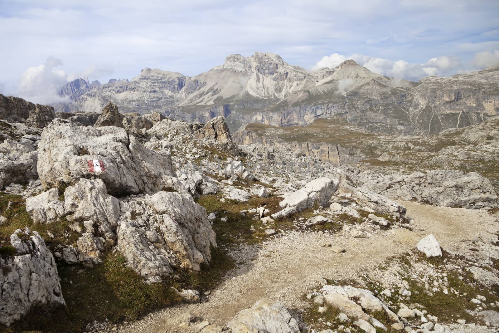 Mountain path in Dolomites, Italy, on a sunny autumn day