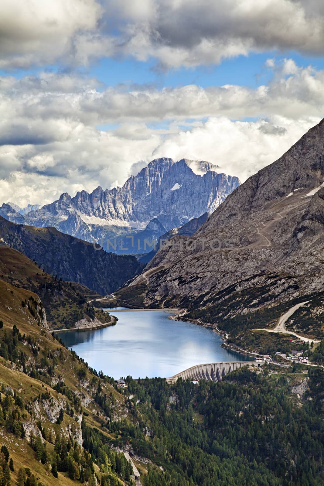 Fedaia lake in Dolomites with view of Marmolada mountain