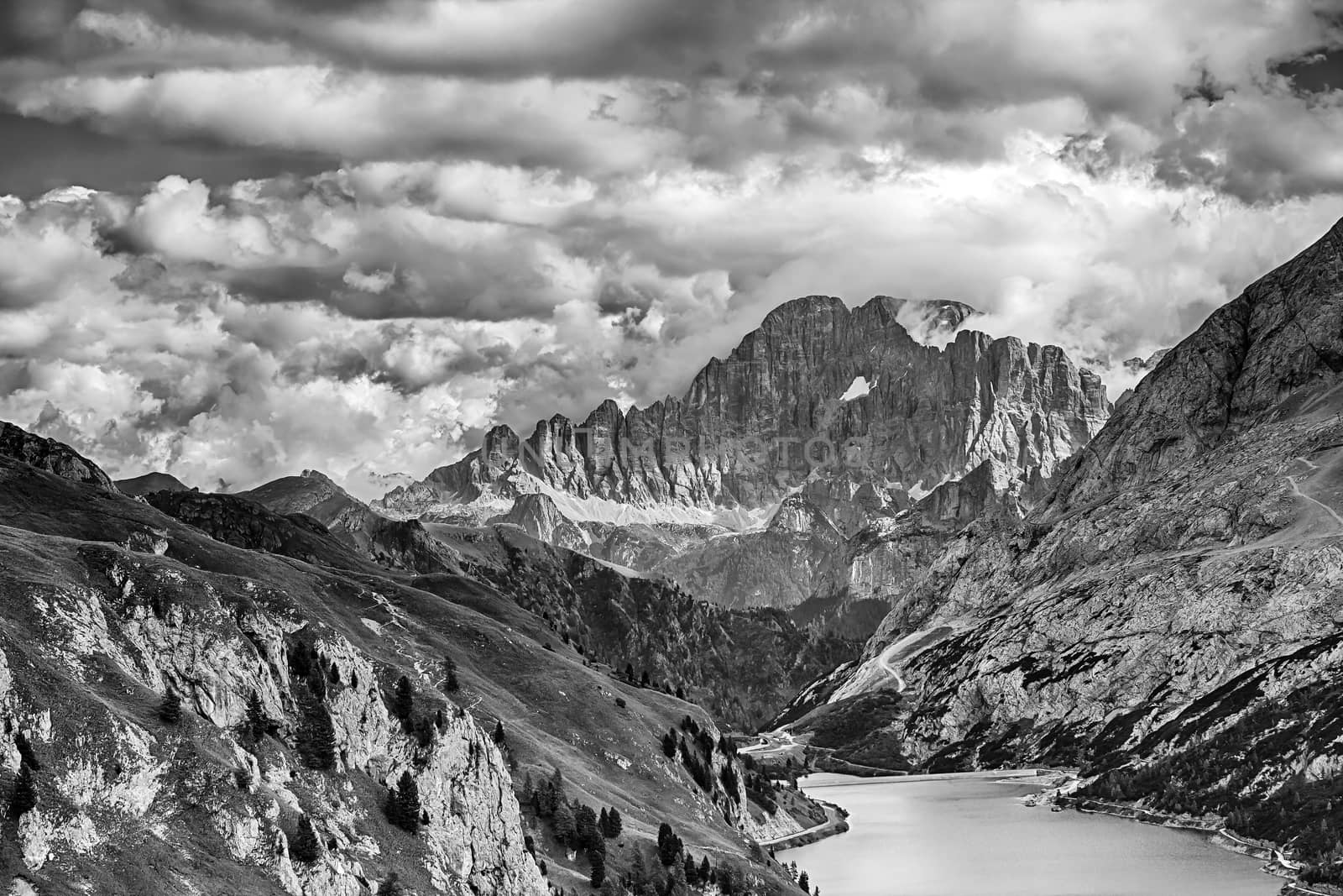 Fedaia lake in Dolomites with view of Marmolada mountain