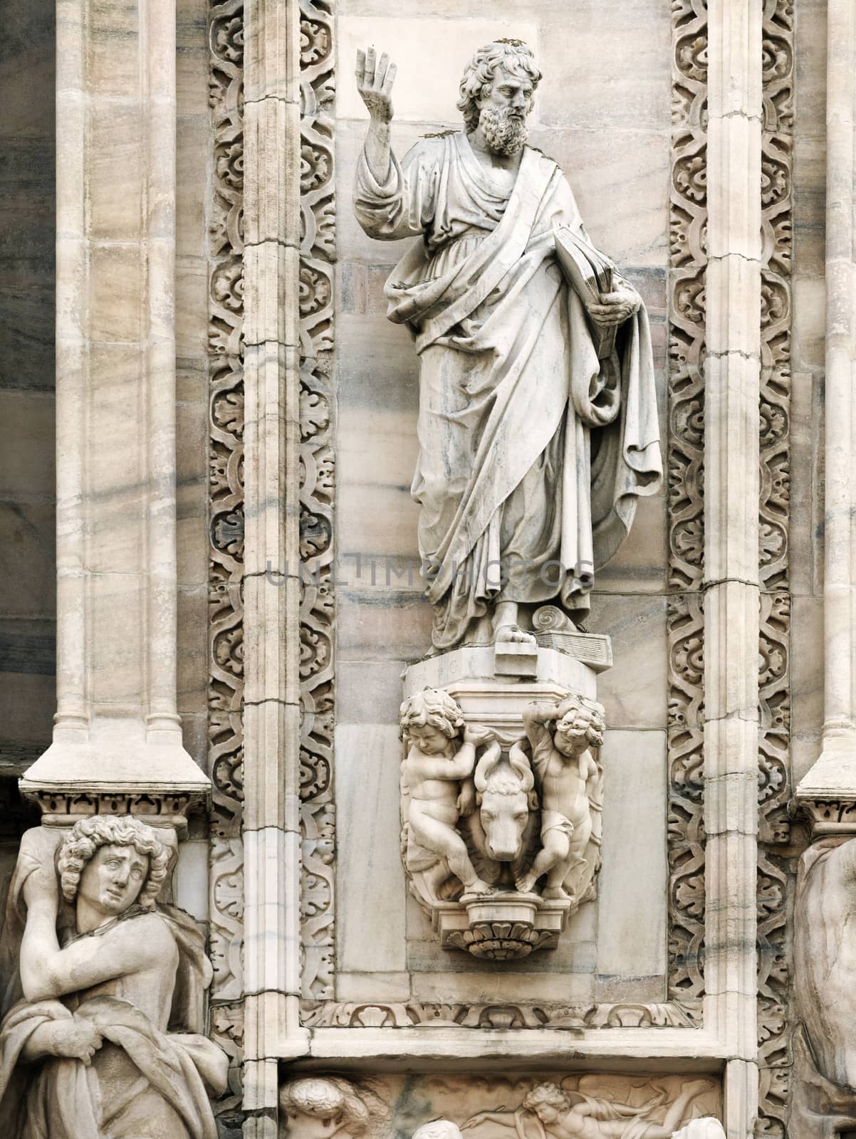 Statue on the wall of cathedral in Milan, Italy