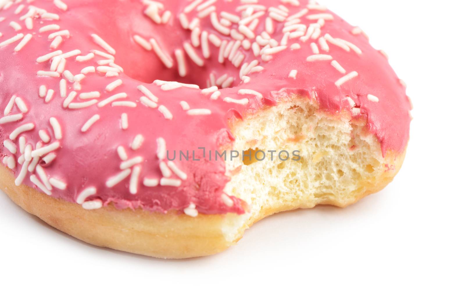 The bitten donut isolated on white background