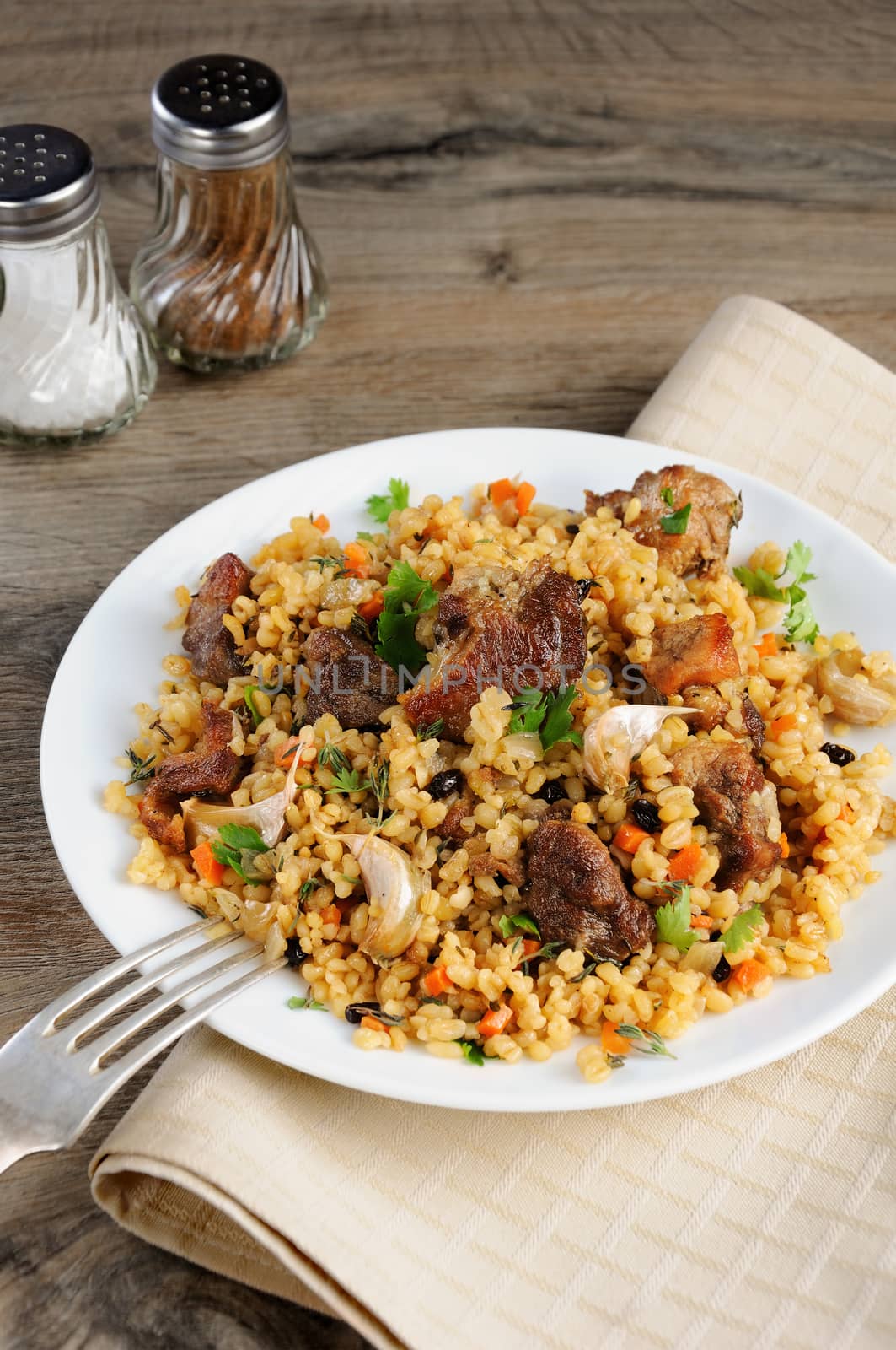 Pilaf   from bulgur with meat, vegetables and barberry