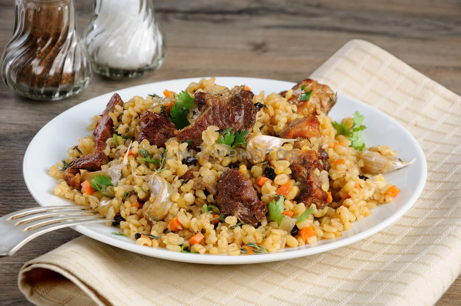 Pilaf   from bulgur with meat, vegetables and barberry
