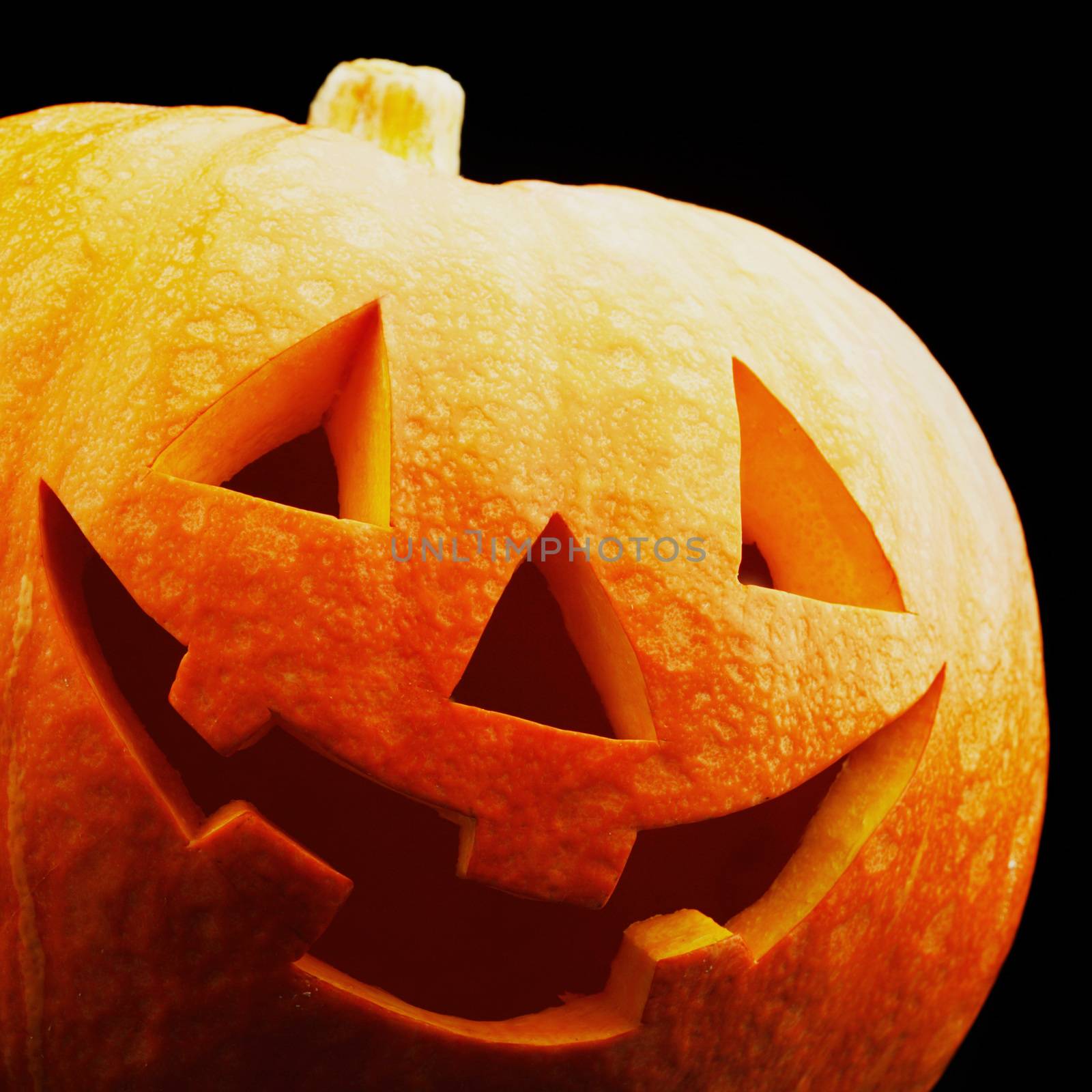 Funny Halloween pumpkin isolated on black background