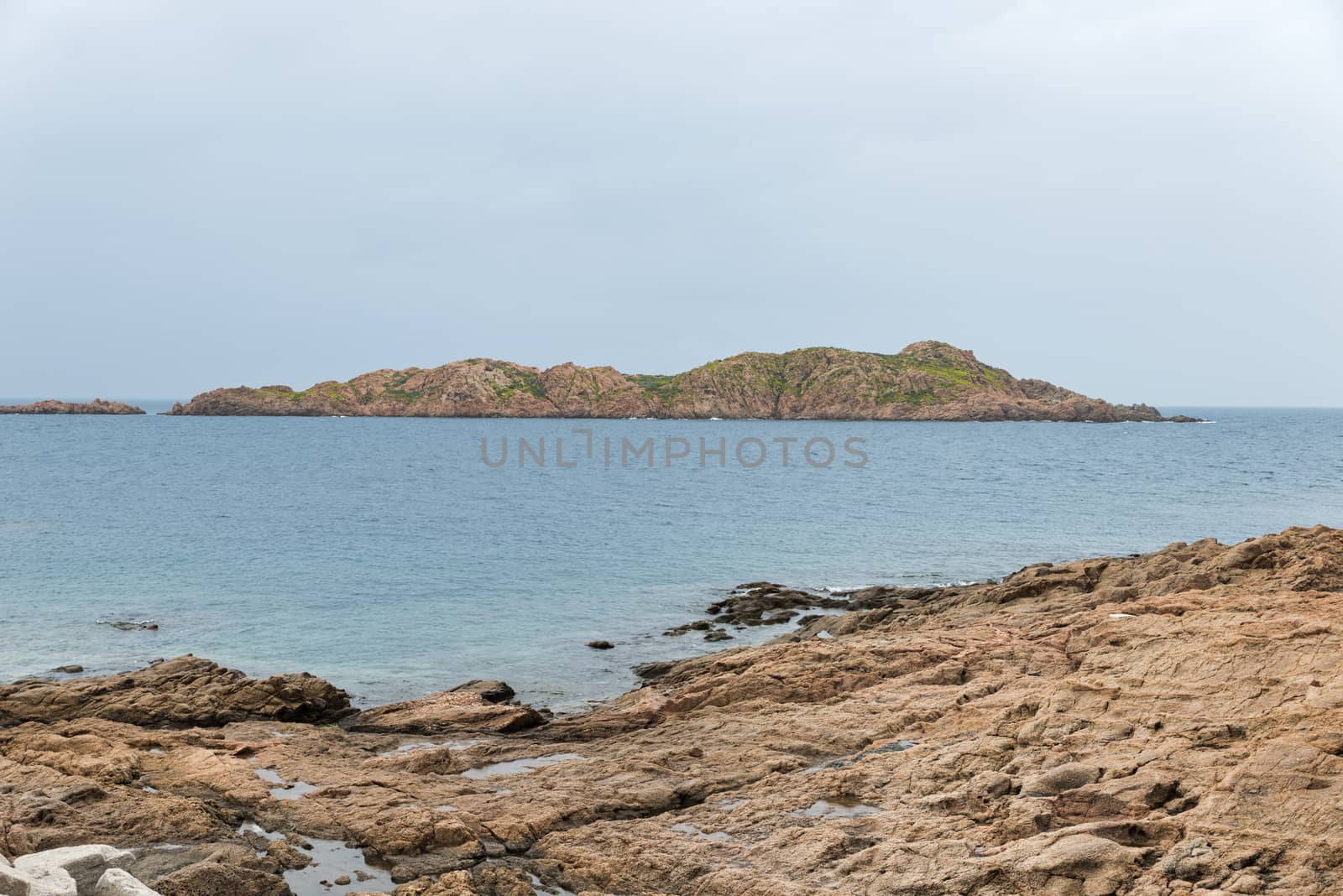 the rocks of isola rossa sardinia by compuinfoto