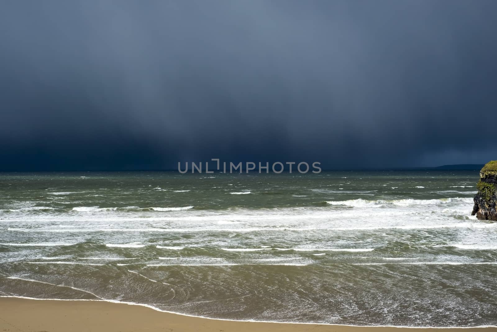 winter rain storm approaching ballybunion beach