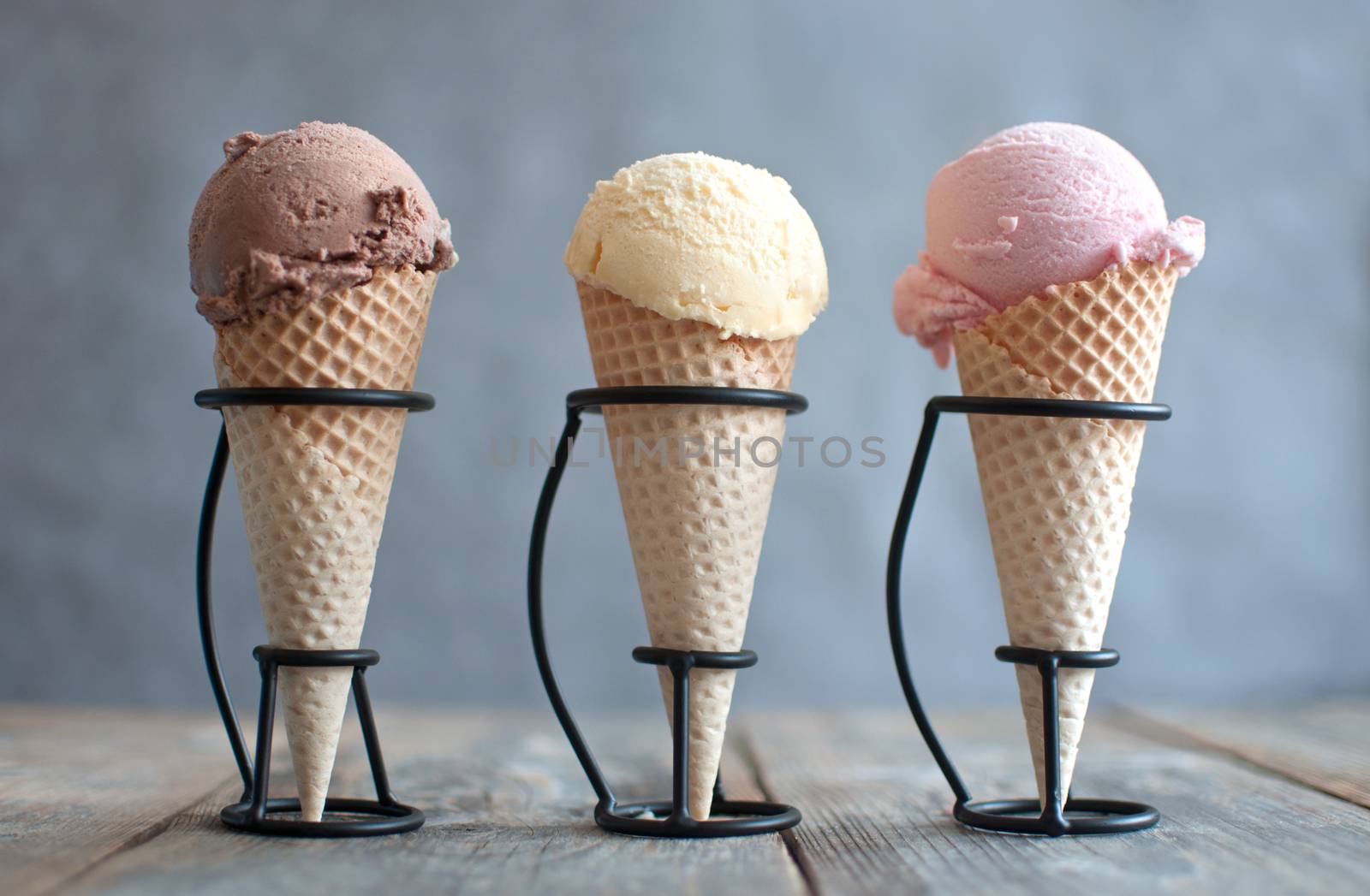 Chocolate, strawberry and vanilla ice cream cones
