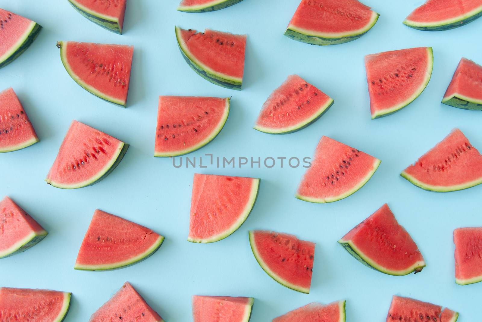 Watermelon slices over a blue background