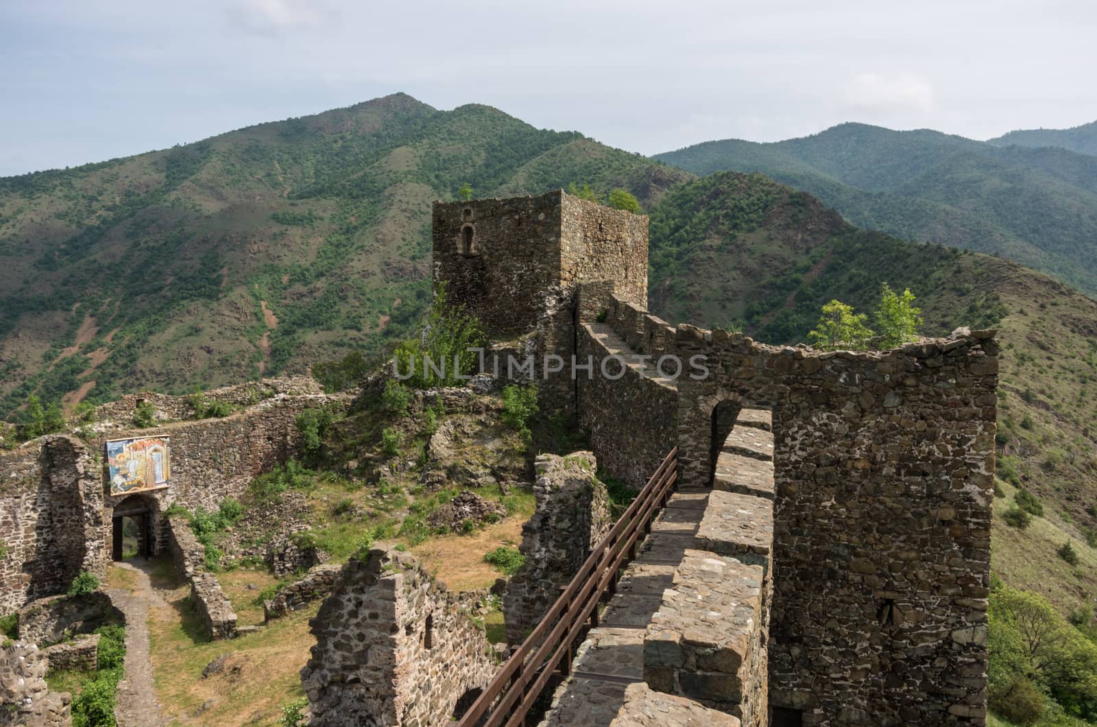 Maglic, Serbia - May 5, 2018: On the wall of medieval fortress Maglic, mountain range at background , Serbia