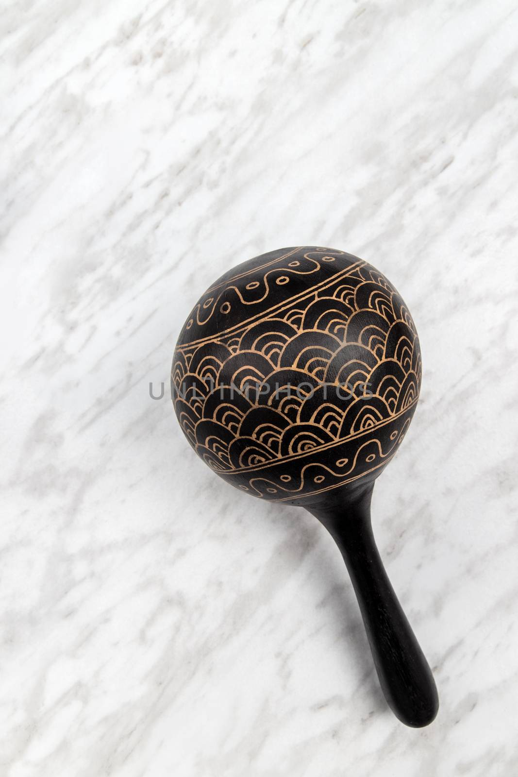 Maracas percussion instrument on marble background by anikasalsera