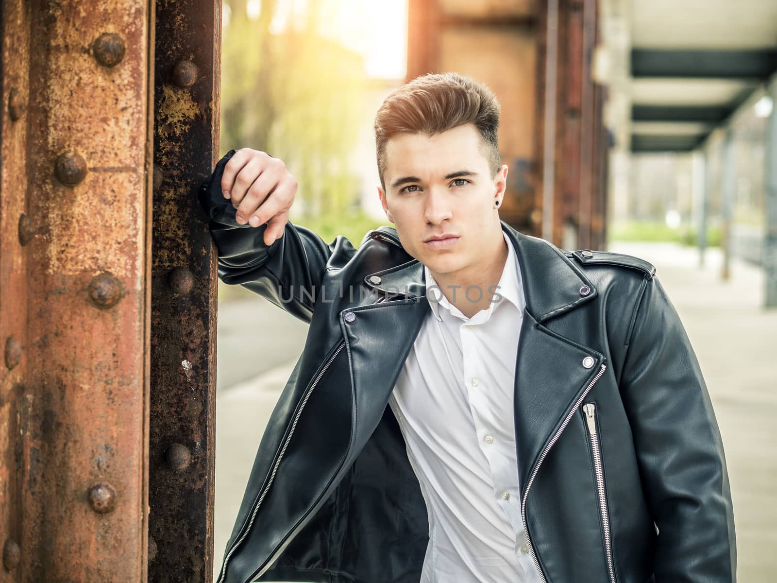 One handsome young man in urban setting by artofphoto