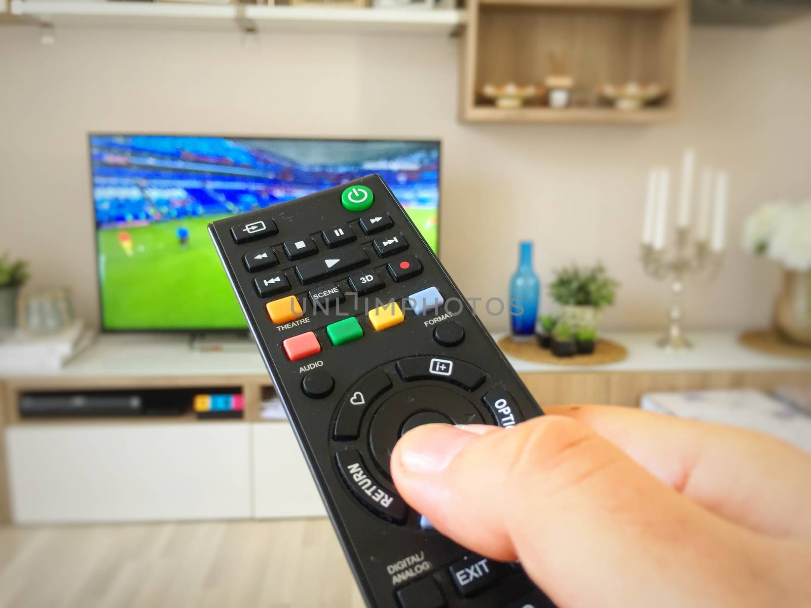 Watching the soccer world cup on television switching with the remote control