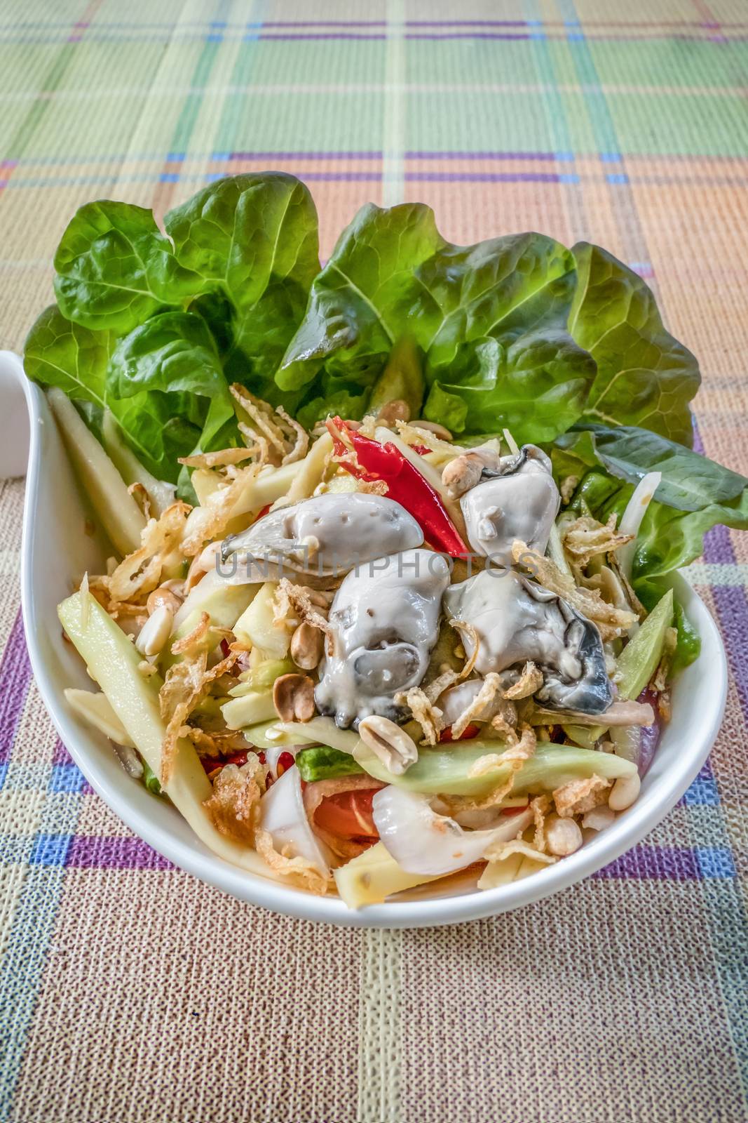 spicy yellow mango salad with fresh oyster , shallot garnish and crispy shallot