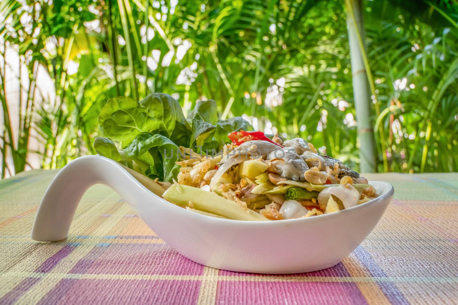 spicy yellow mango salad with fresh oyster , shallot garnish and crispy shallot