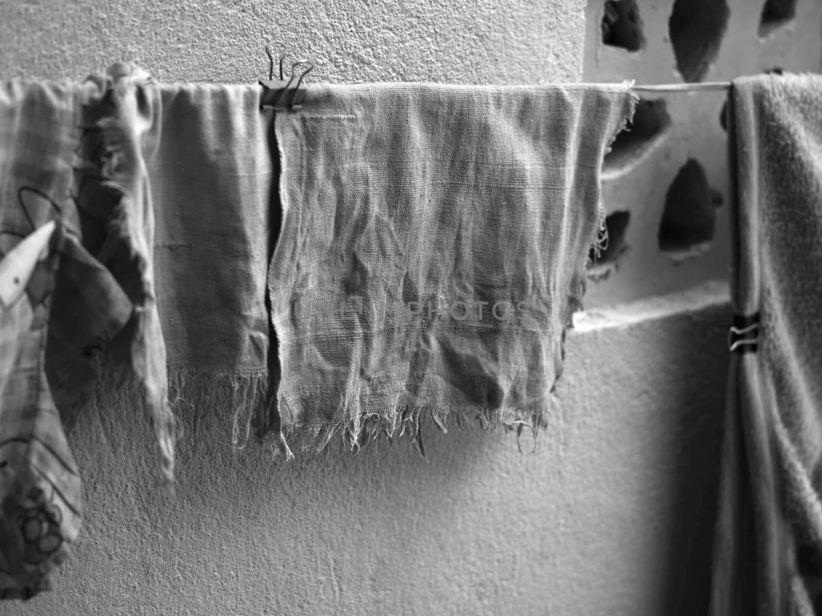 OLD AND FADED HANDKERCHIEF DRYING OUTSIDE by PrettyTG
