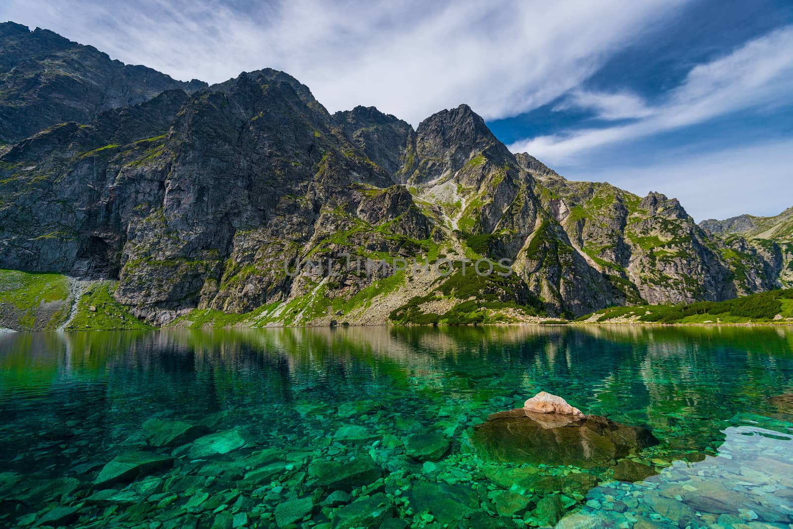 High Tatra mountains and picturesque clear lake Czarny Staw by kosmsos111