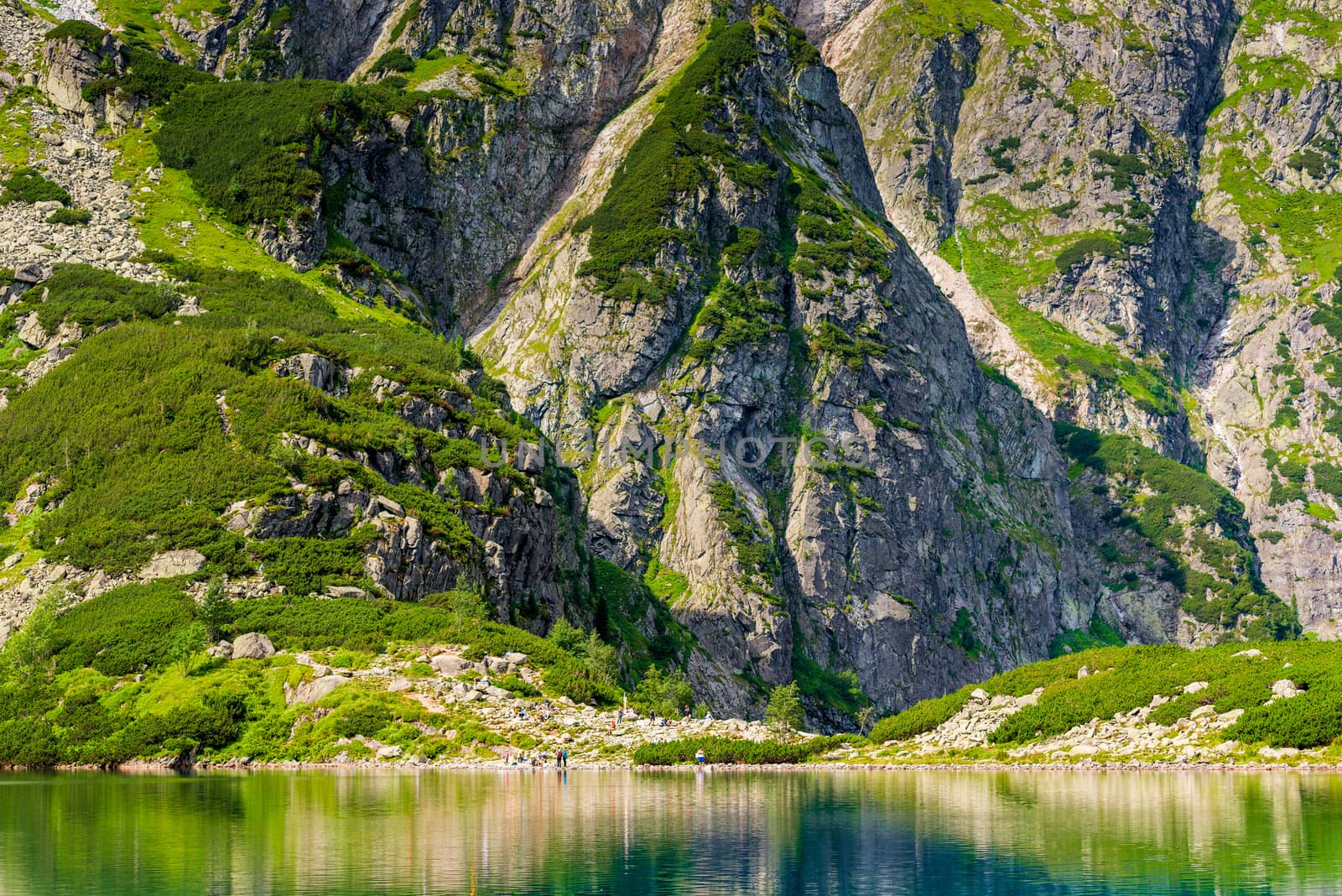 beautiful picturesque mountains of the Tatra and a lake Czarny Staw with clear water