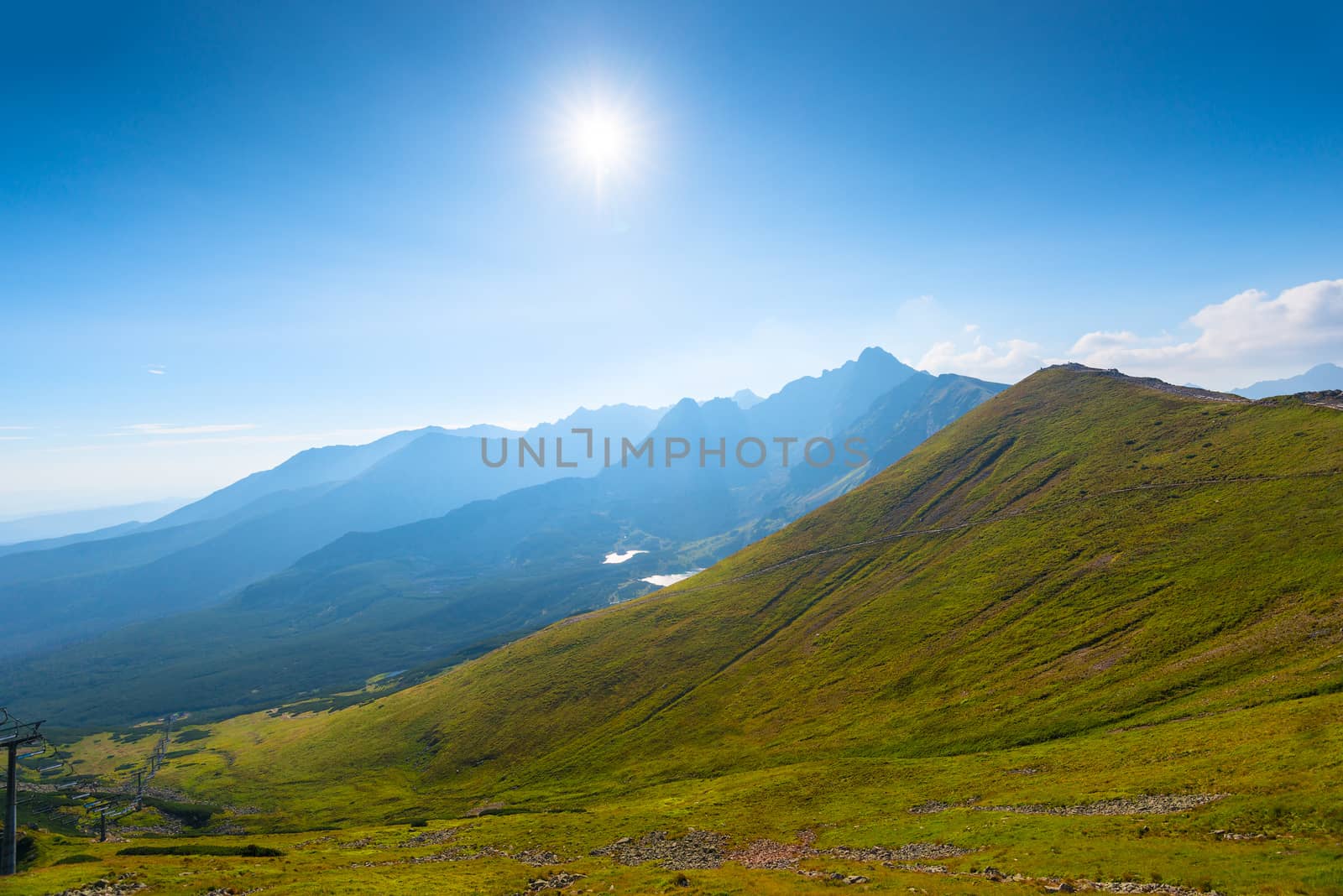 Bright sunshine over high beautiful mountains in Poland Kasprowy Wierch