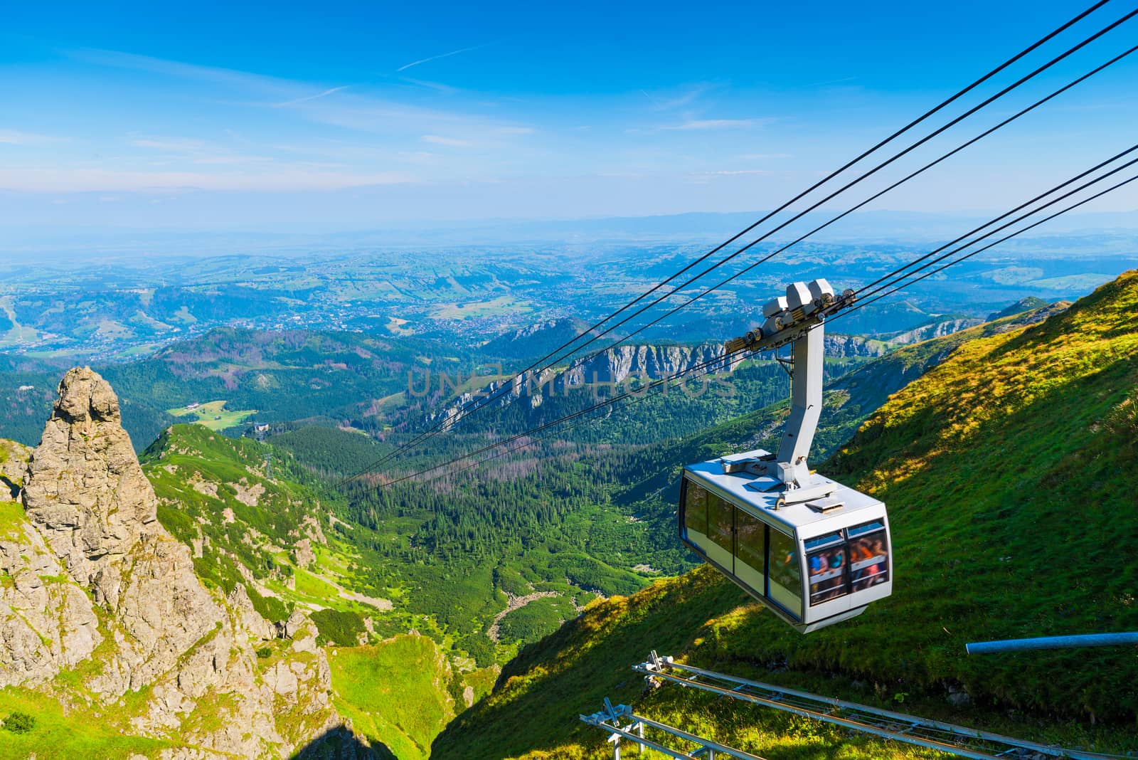 cable car on the ropes, going to Mount Kasprowy Wierch, Poland. Beautiful view of the valley