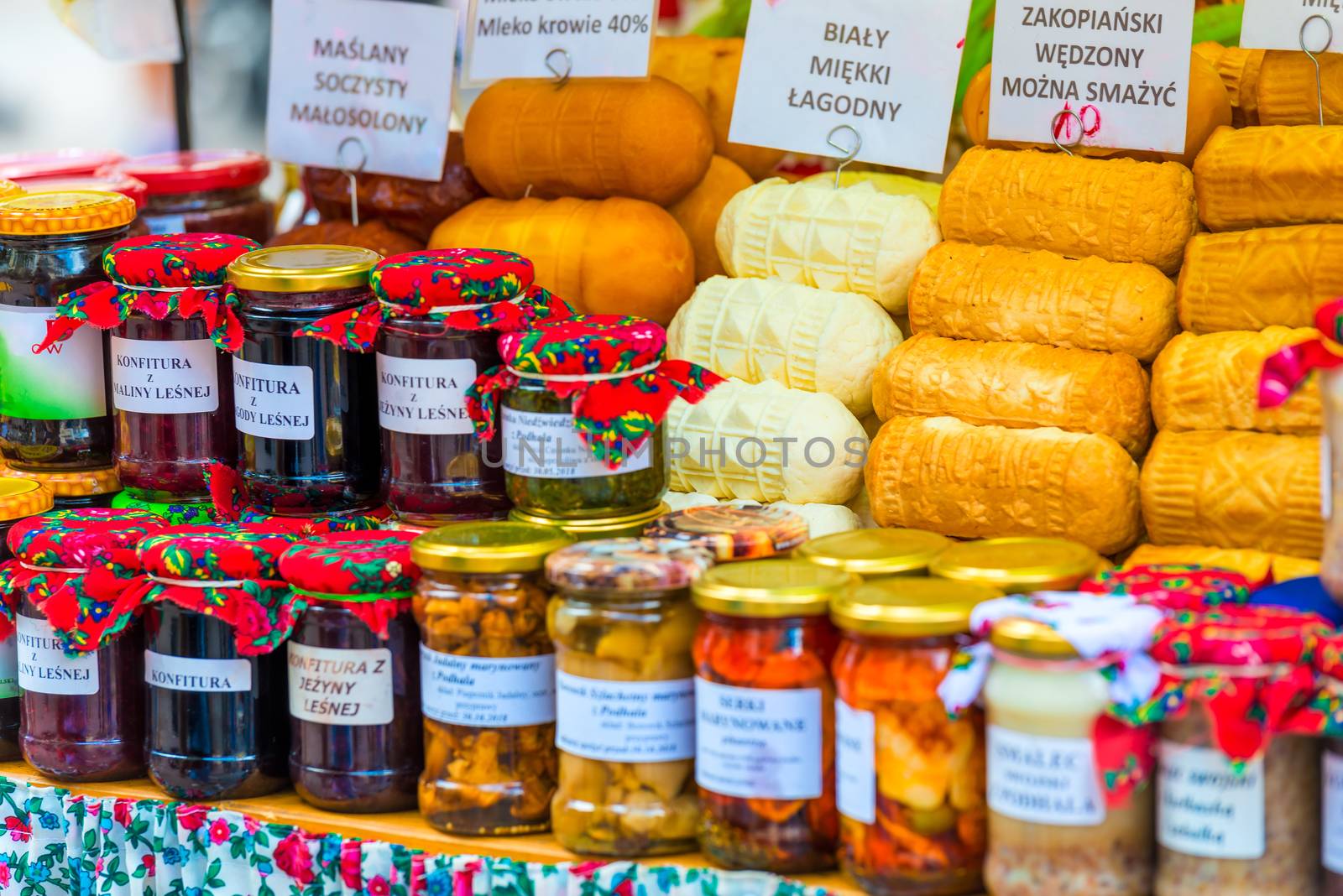 traditional cheeses of Zakopane in the showcase of the market in by kosmsos111