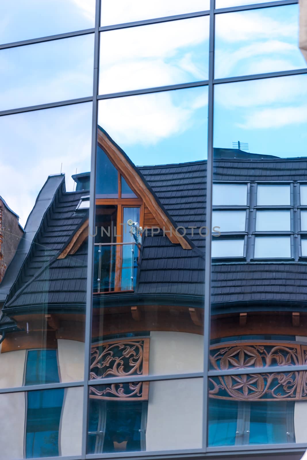 mirror wall of a building with a reflection of a wooden house by kosmsos111