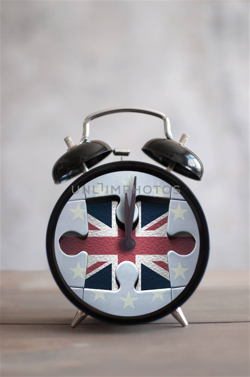Clock with missing piece from a jigsaw piece british flag