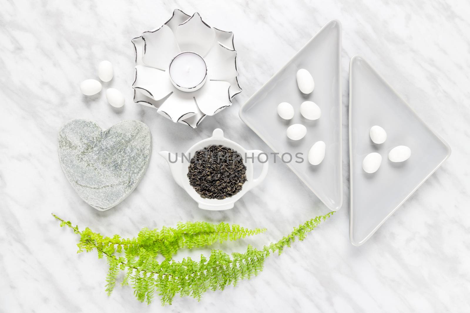 Green tea leaves, white chocolate and home decor styling by anikasalsera