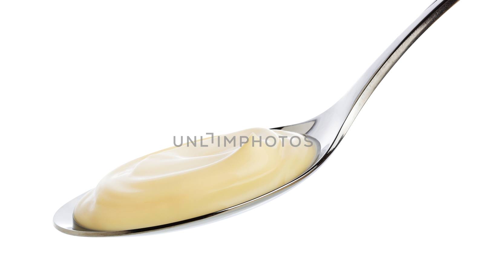 Sour cream in spoon isolated on white background with clipping path.