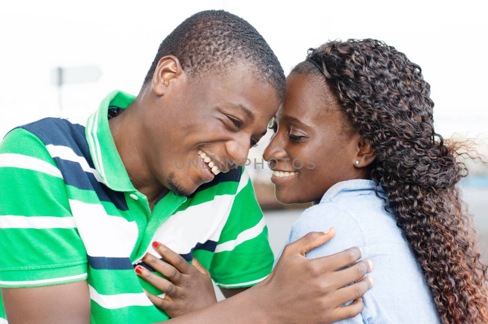 Young couple in love laughing together as tey looked.