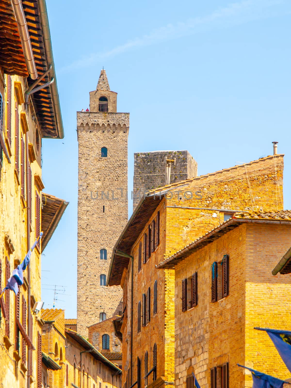 Torre Grossa, Big Tower. Bottom view from medieval streets of San Gimignano, Italy