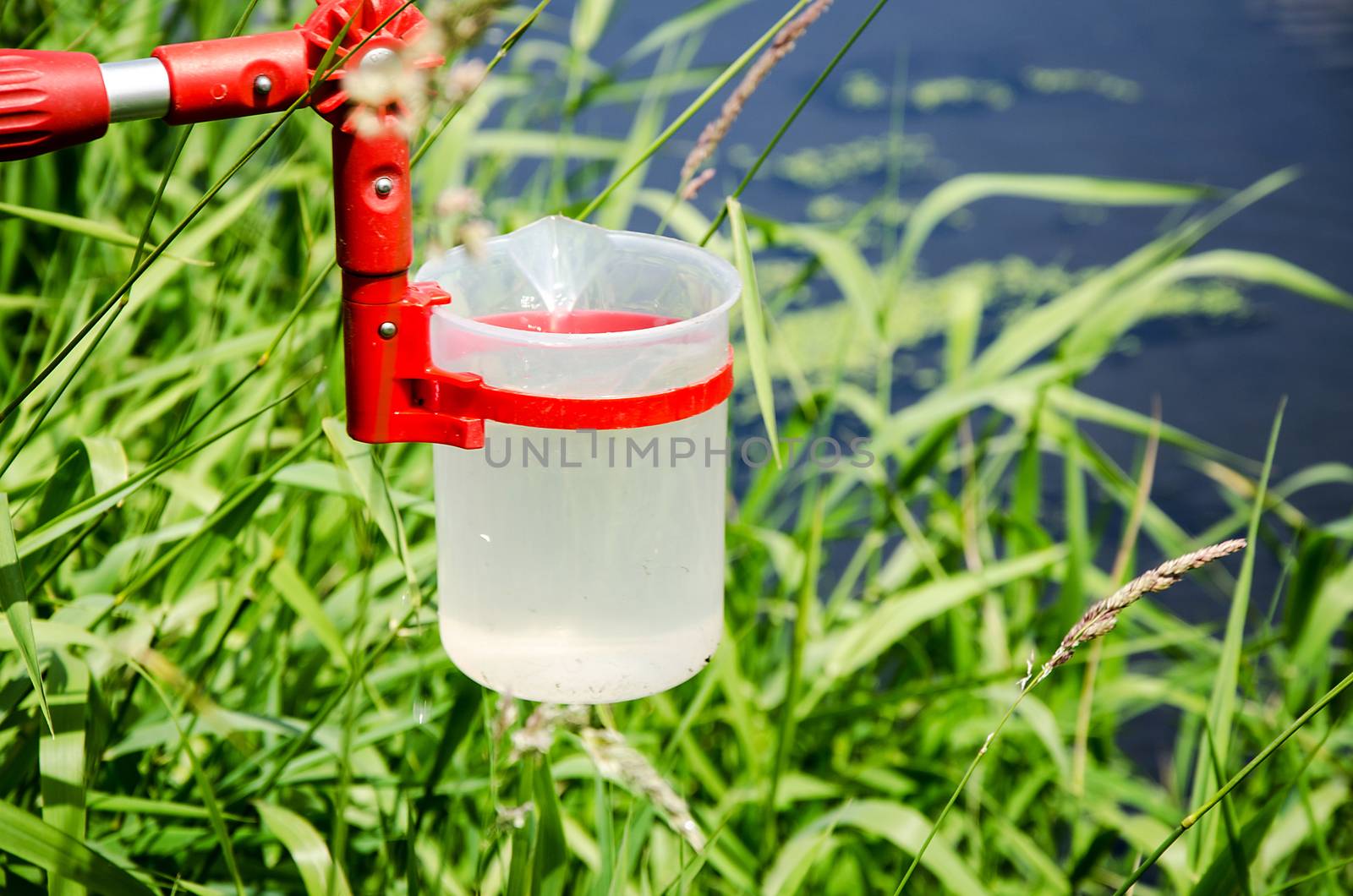 Take samples of water for laboratory testing. The concept - analysis of water purity, environment, ecology