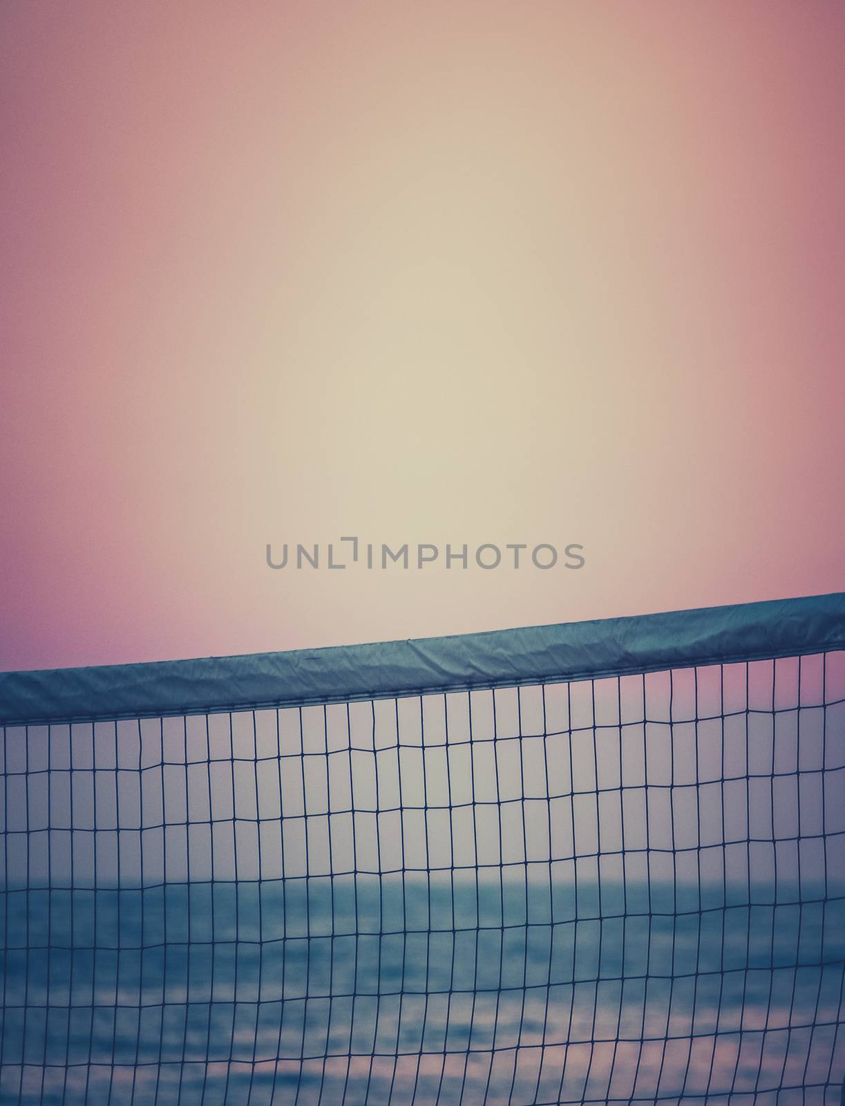 Retro Filtered Beach Volleyball Net At Sunset With Copy Space