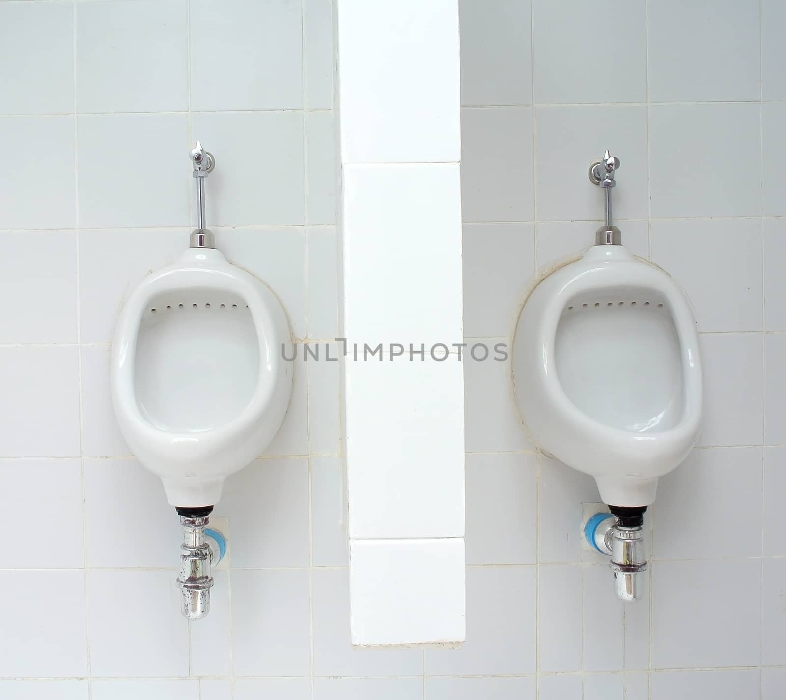 White ceramic sanitary ware in restroom by sommai