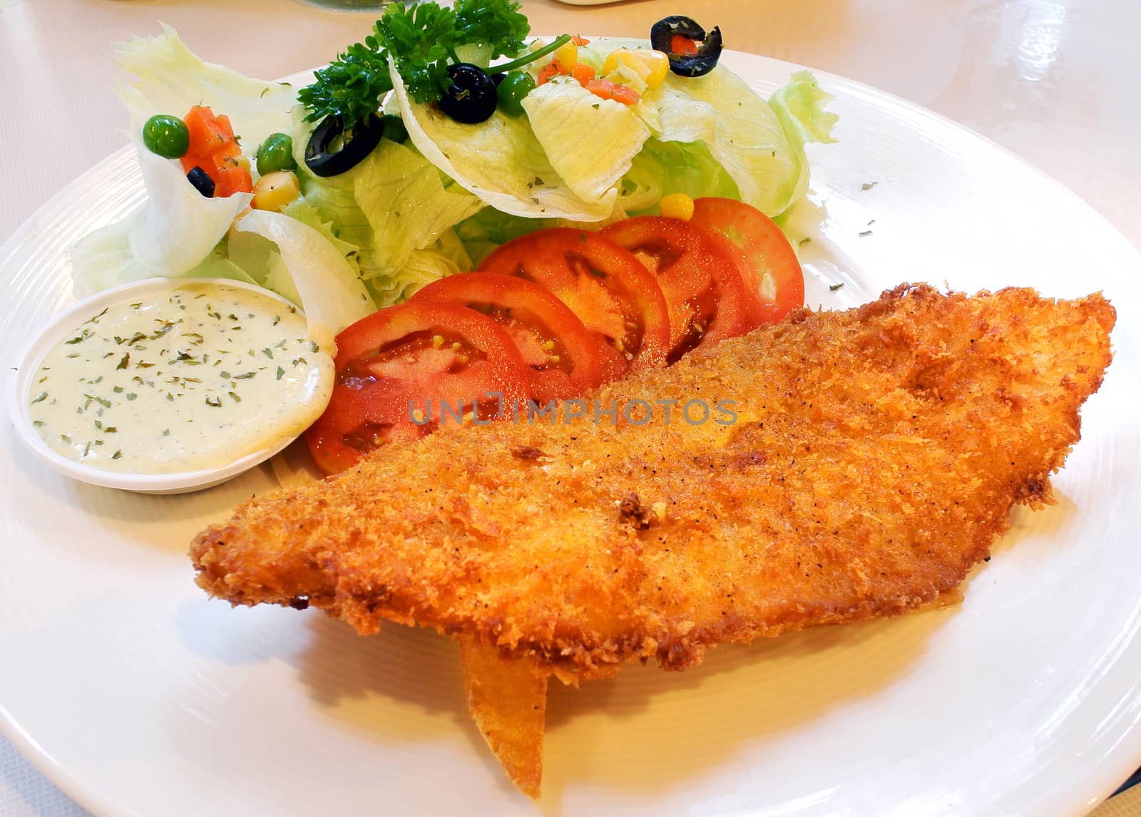 fried fish and salad by sommai