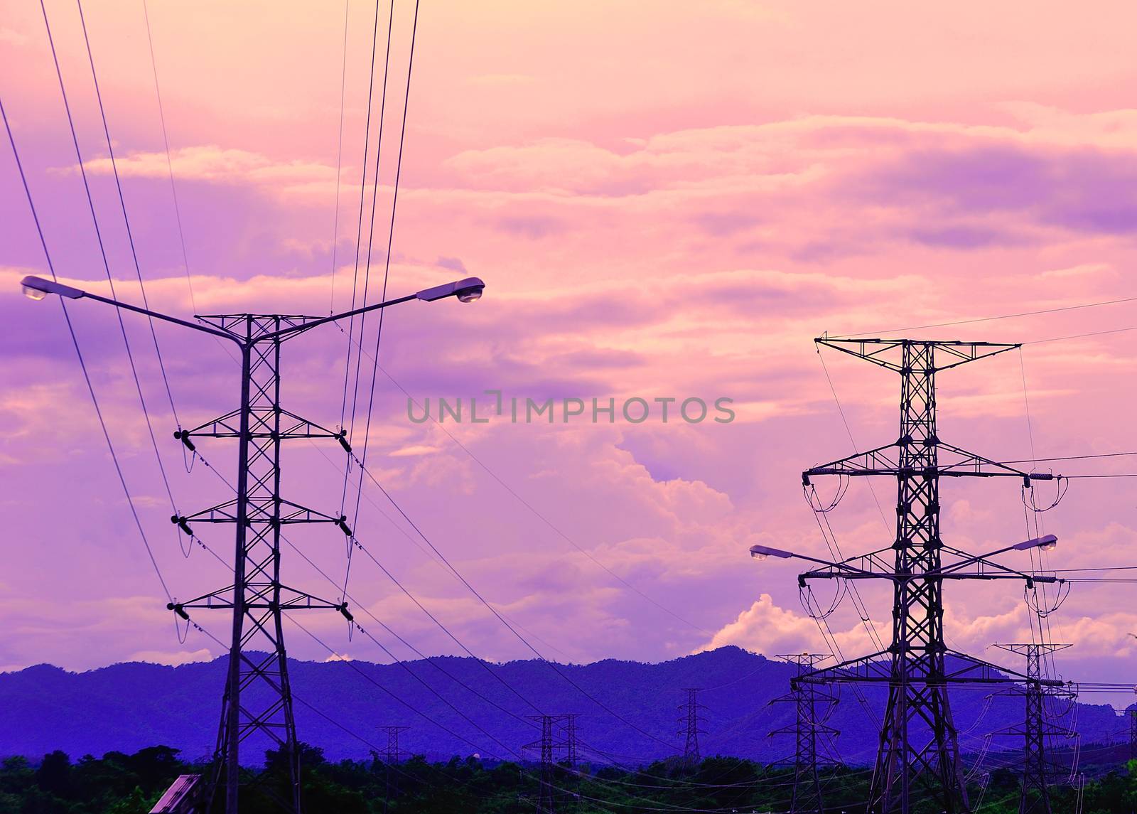 Electricity pylons at sunset by sommai