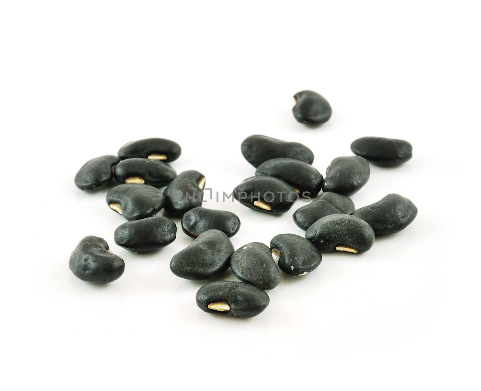 A small handful of black beans - preto. Beans isolated on a whit by sommai