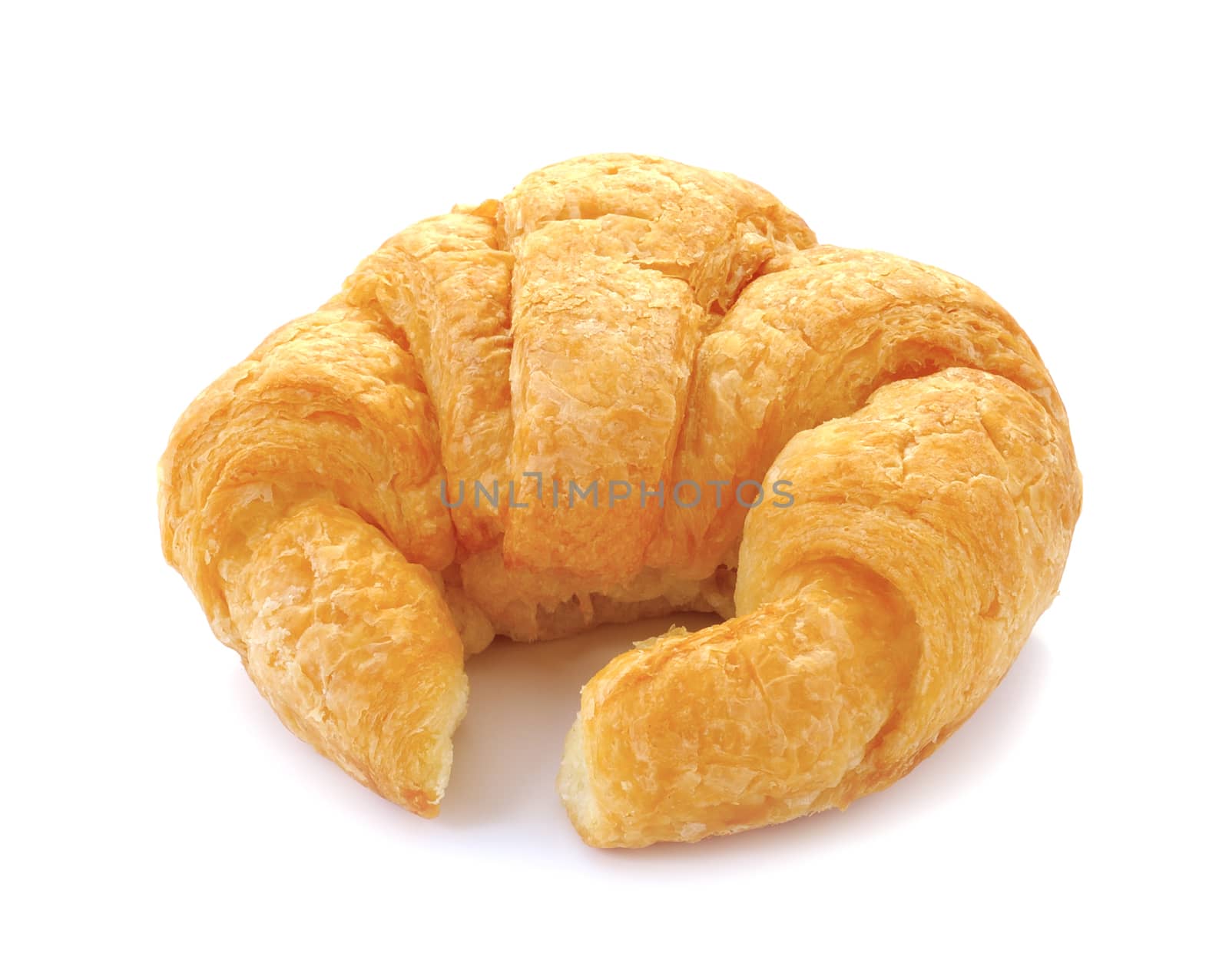 Fresh and tasty croissant over white background by sommai