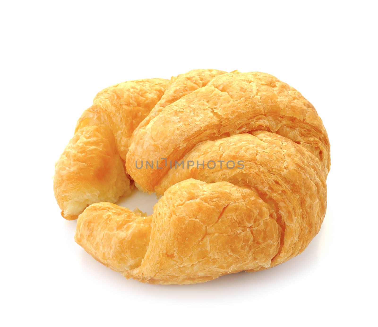 Fresh and tasty croissant over white background by sommai