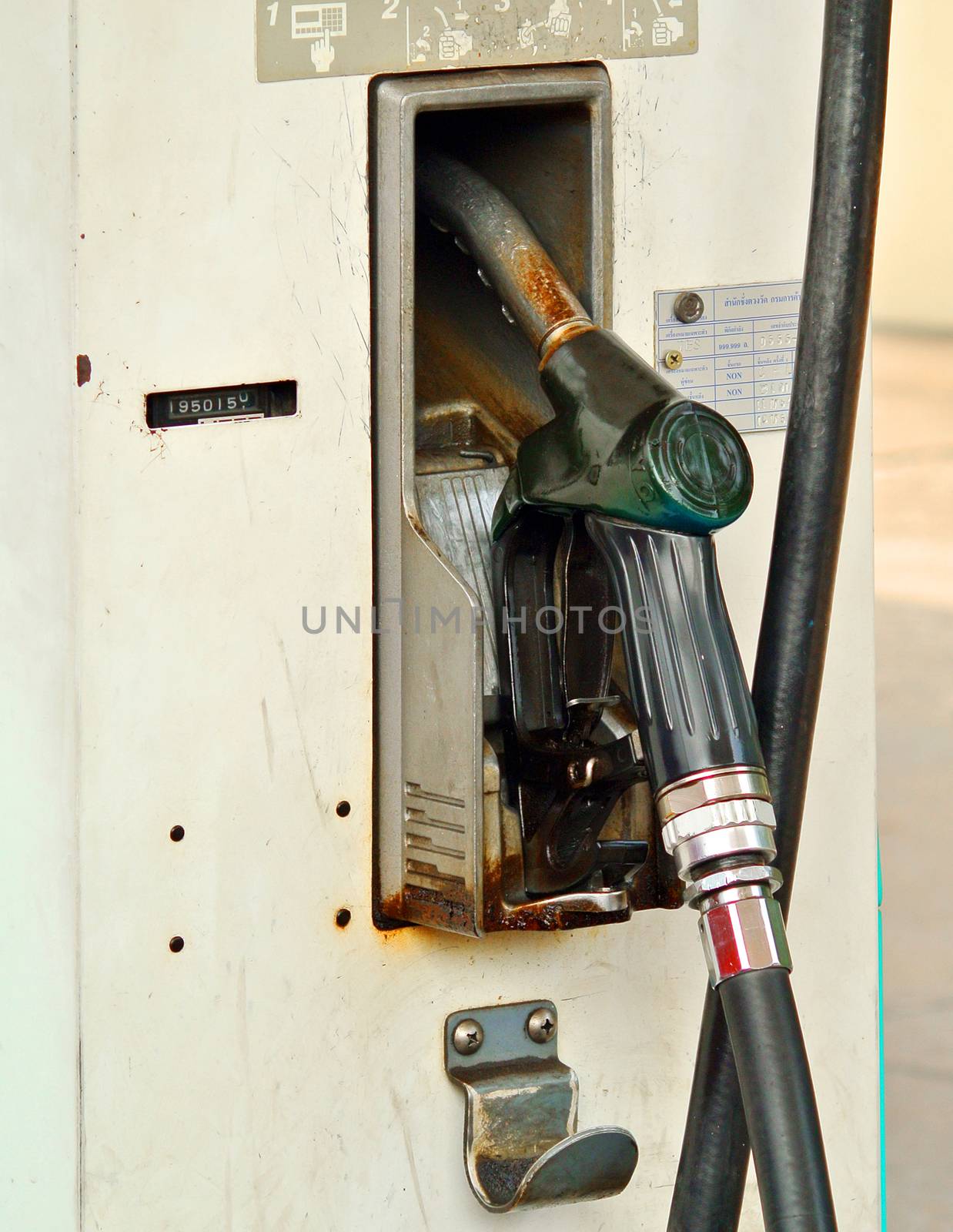  fuel oil gasoline dispenser at petrol filling station by sommai