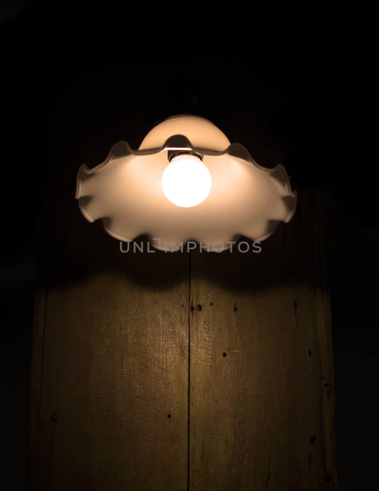 Lamp on a wall shining