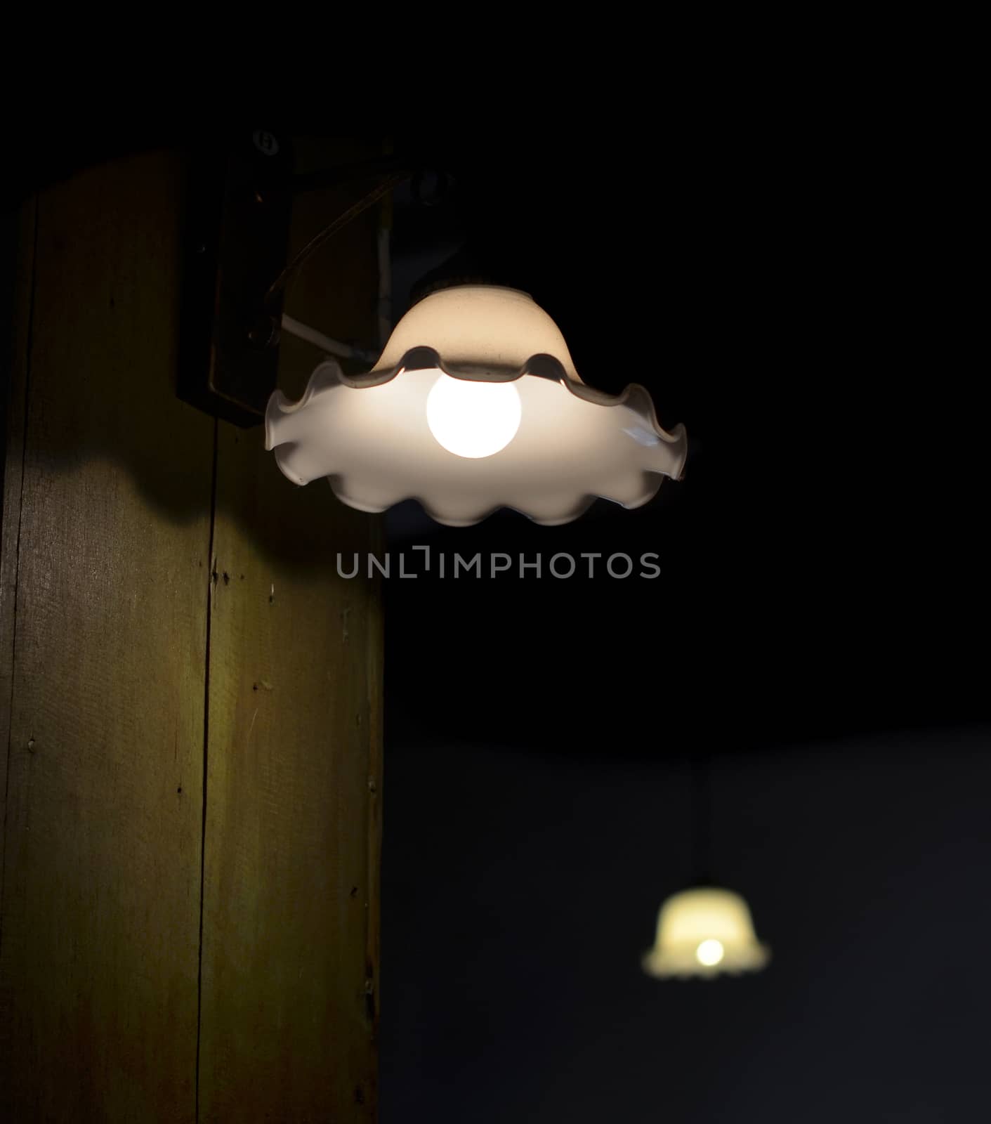 Lamp on a wall shining