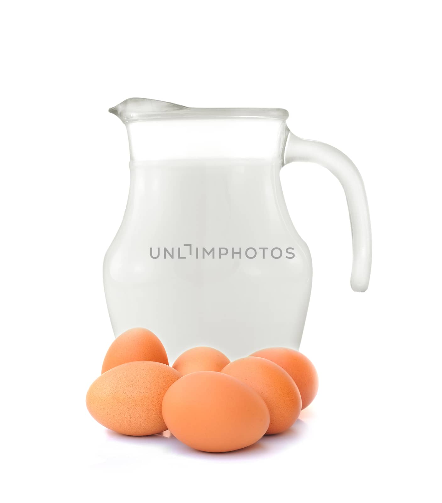 Glass jug of fresh milk and egg on white background