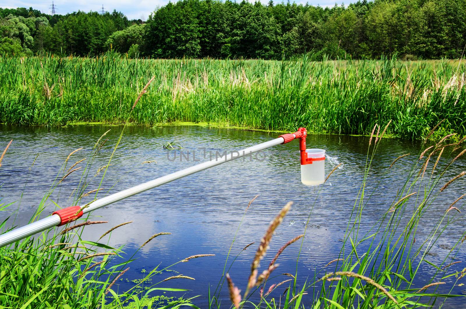 Take samples of water for laboratory testing. The concept - analysis of water purity, environment, ecology