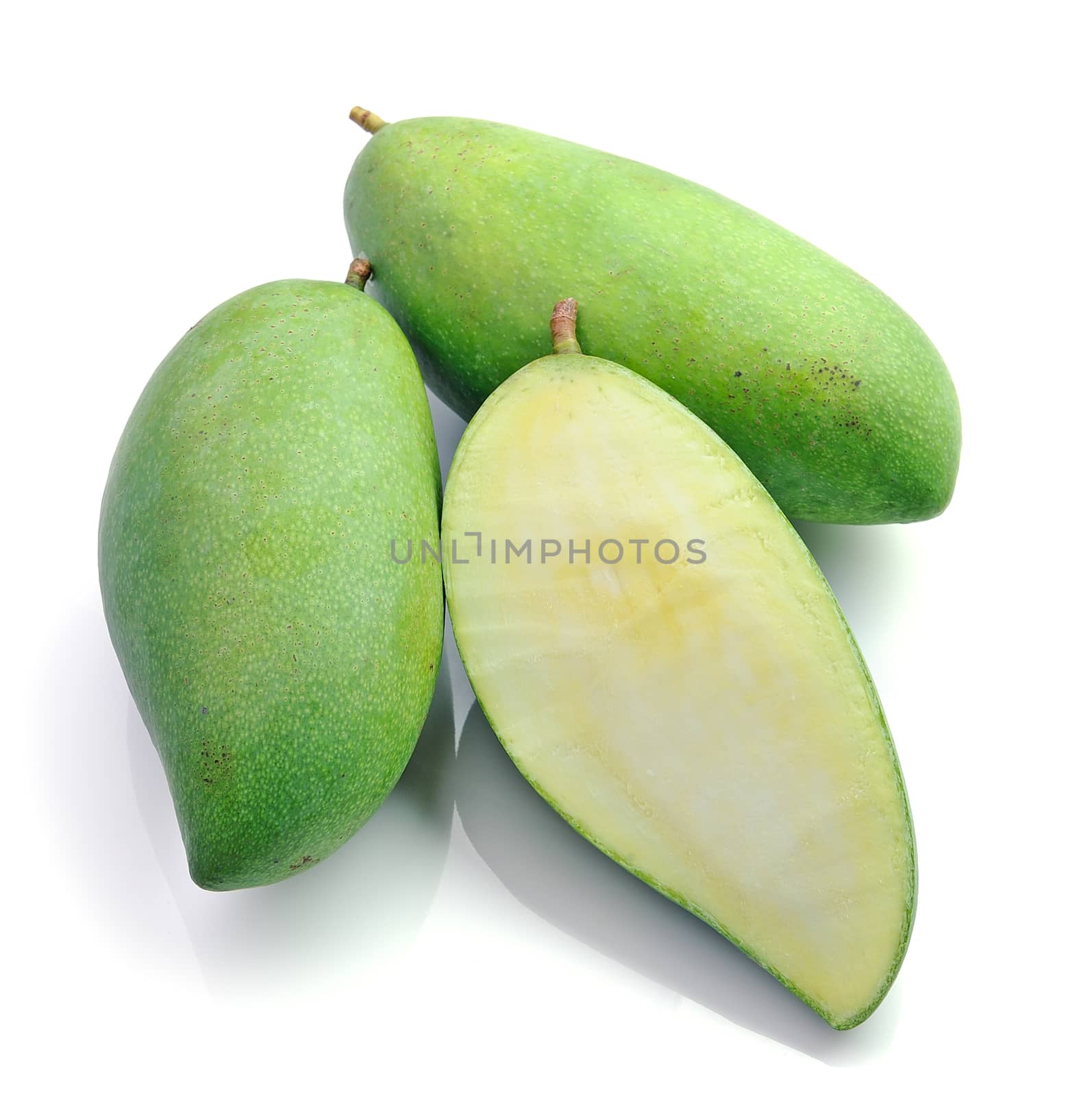 Green mango isolated on a white background by sommai