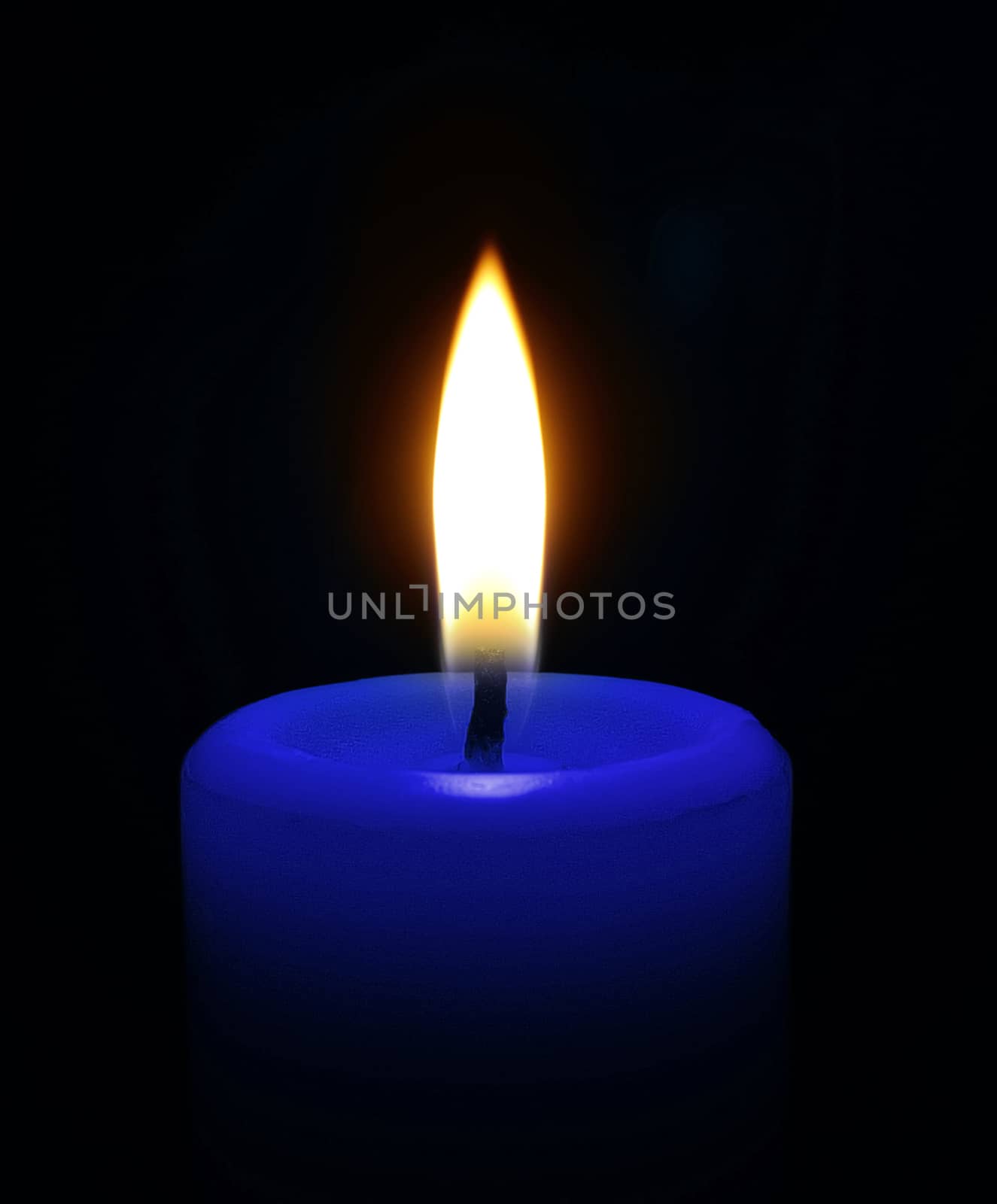 Candle on black background