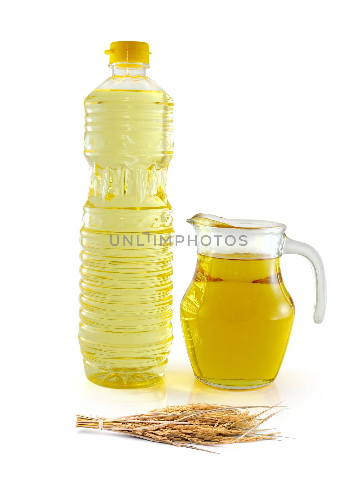 Rice bran oil in bottle glass with seed and bran on white background