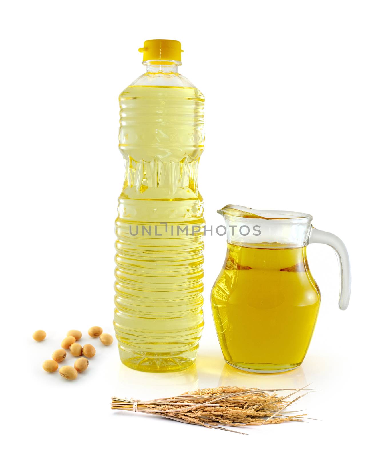 Rice bran oil in bottle glass with seed and soy on white background