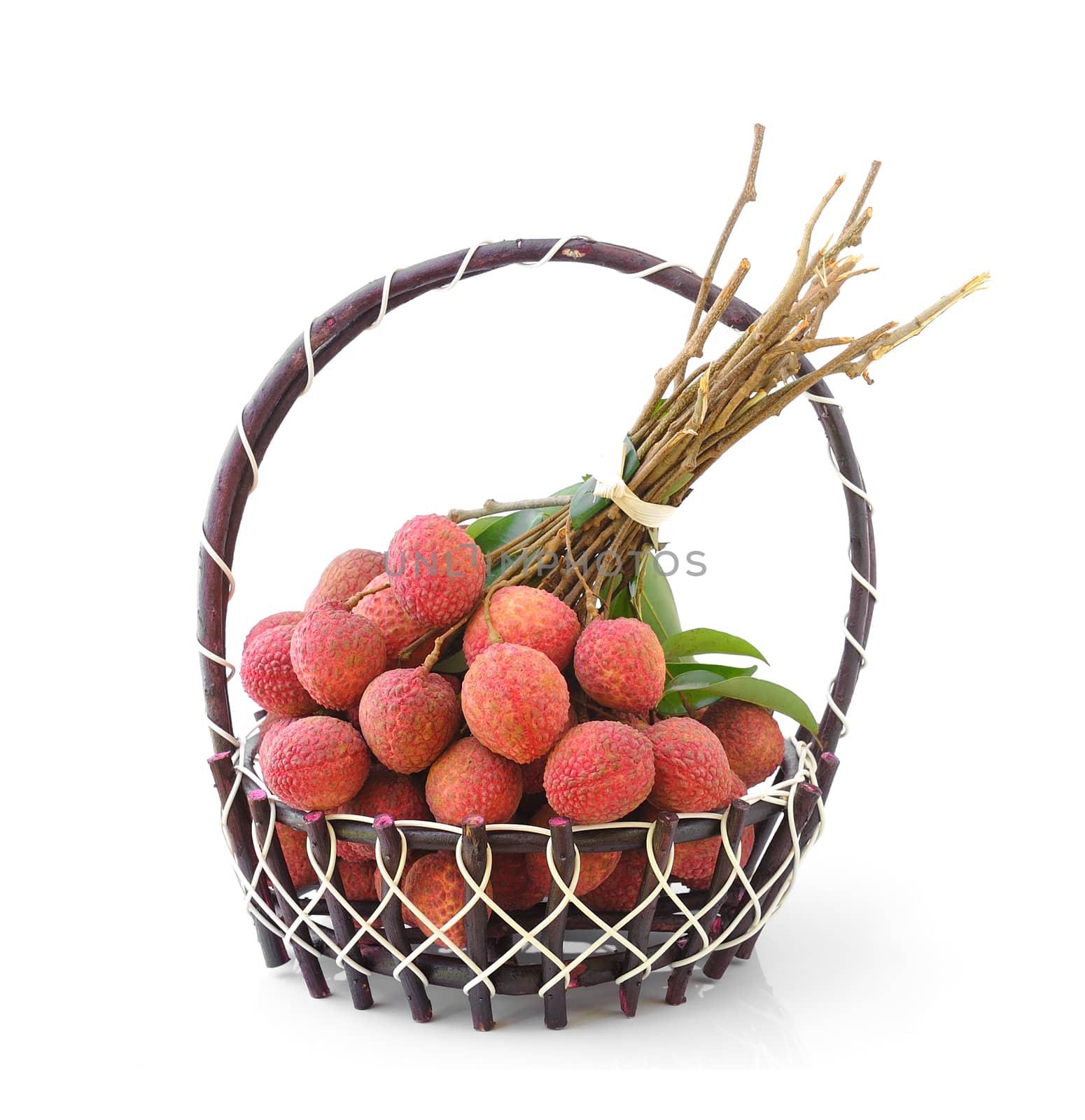 Fresh lychee fruit in basket isolated on white background by sommai