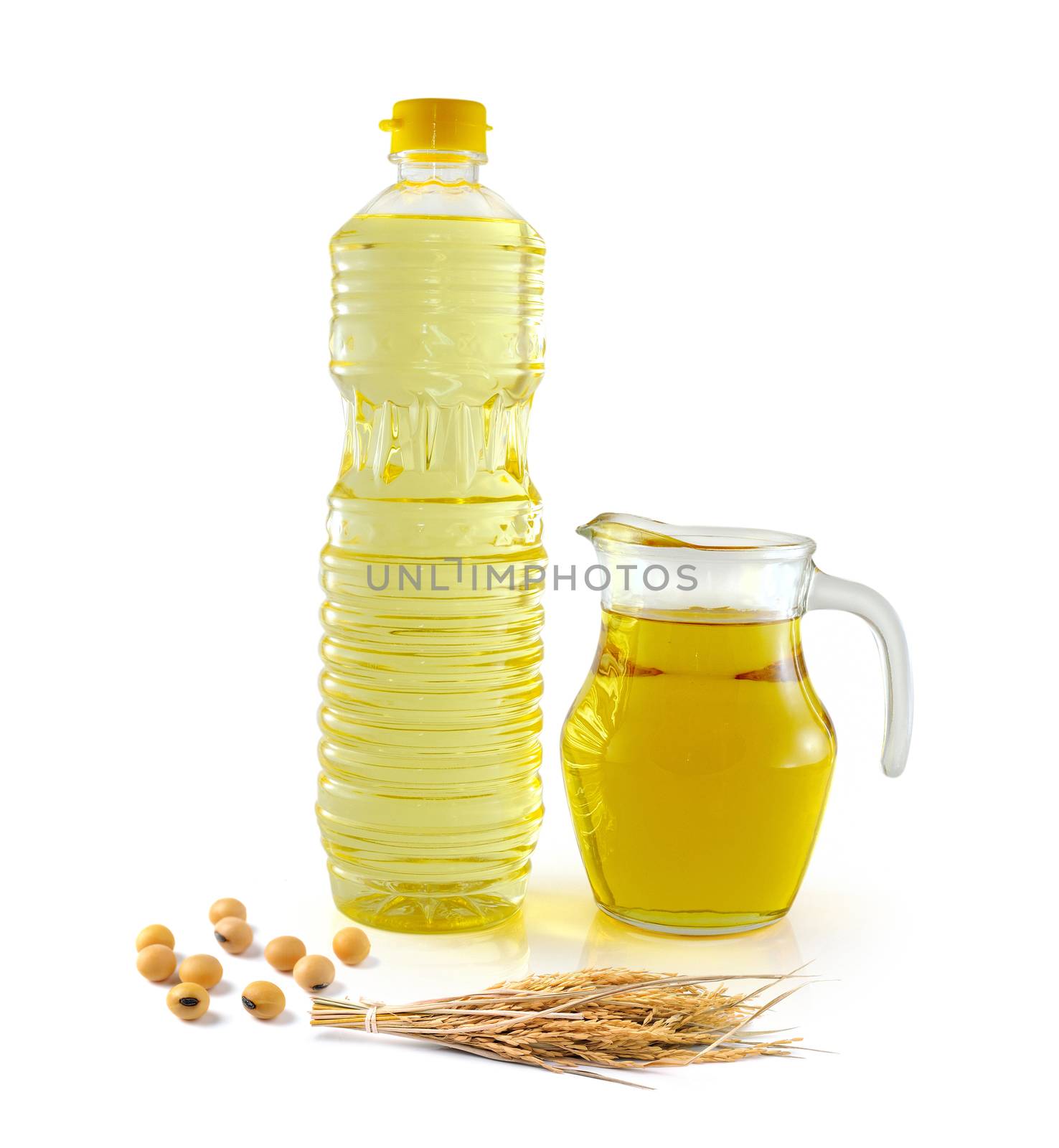 Rice bran oil in bottle glass with rice and soy on white background