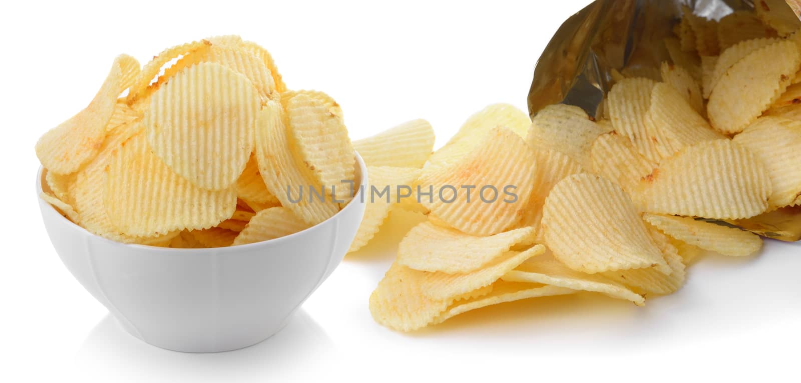heap of potato crisps on white background by sommai
